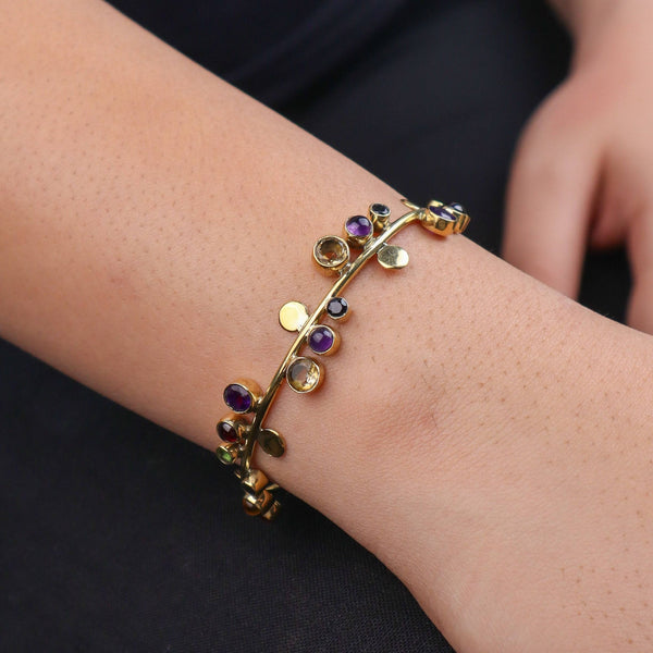 Model wearing a brass fashion bracelet for a stylish and contemporary fashion jewellery look