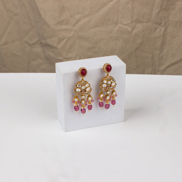 Angled view of a 22K gold-plated fashion earring highlighting its elegant silhouette, structure, and polished gold finish