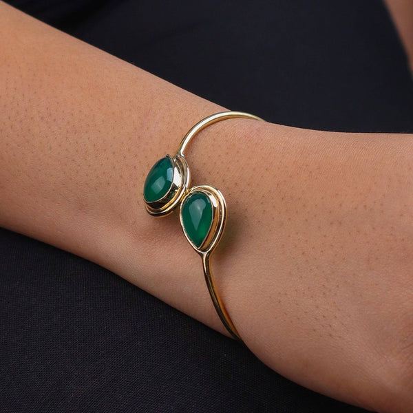 Model wearing a brass fashion bracelet for a stylish and contemporary fashion jewellery look