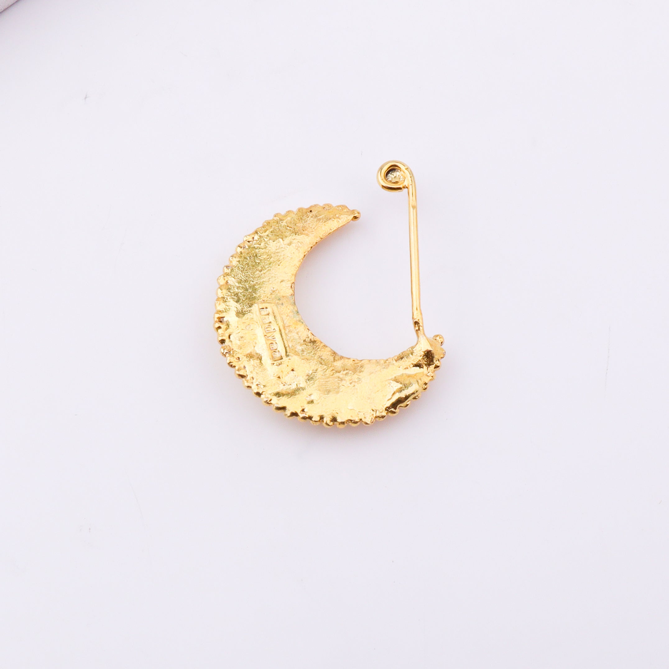 Gold plated crescent moon jewelry with beaded detail on white background