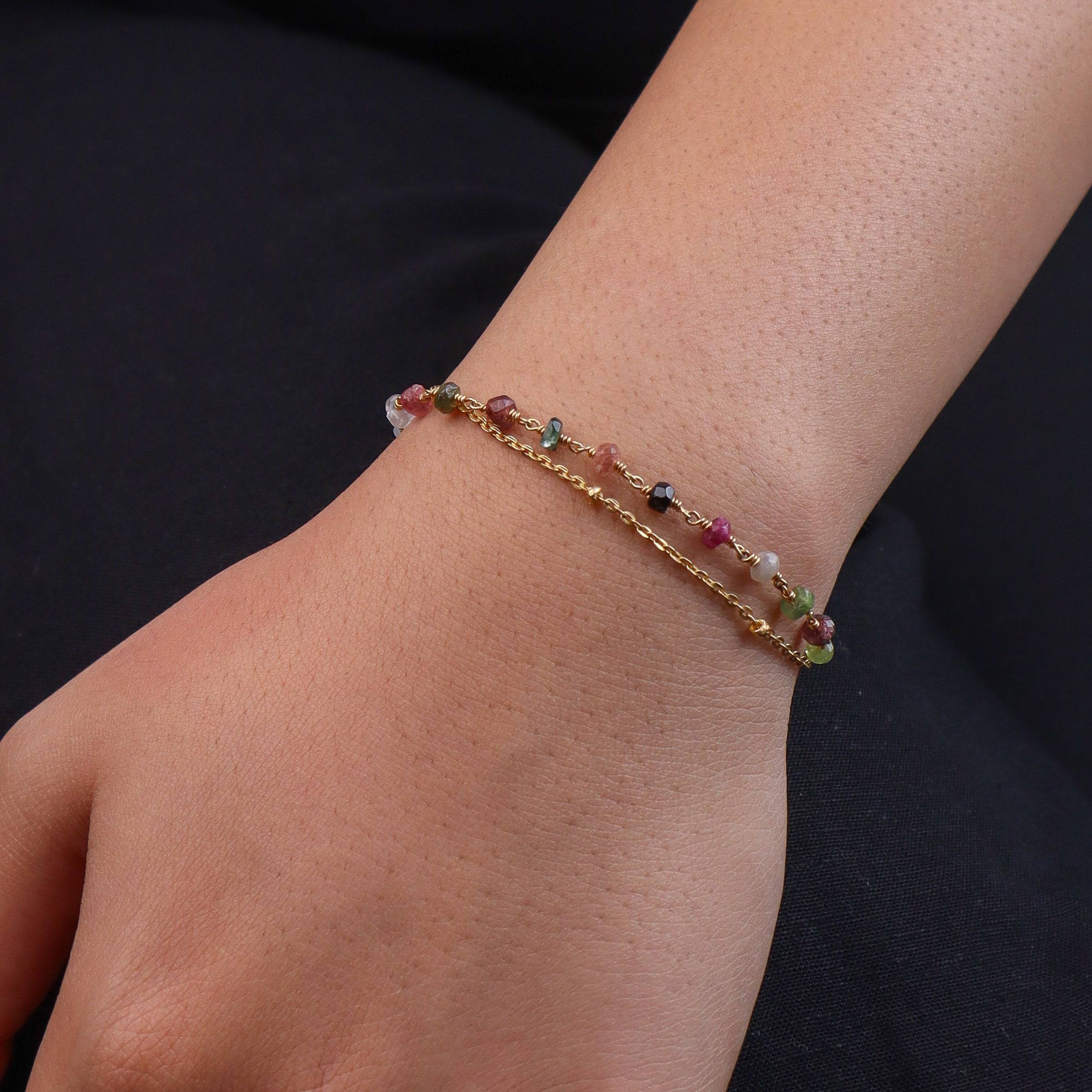 Model wearing a brass fashion bracelet for a stylish and contemporary fashion jewellery look
