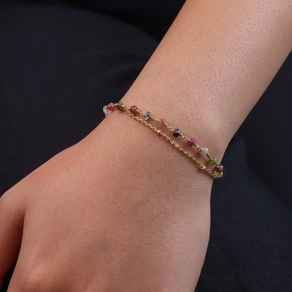 Model wearing a brass fashion bracelet for a stylish and contemporary fashion jewellery look