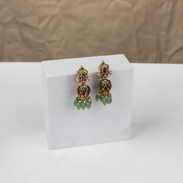 Angled view of a 22K gold-plated fashion earring highlighting its elegant silhouette, structure, and polished gold finish