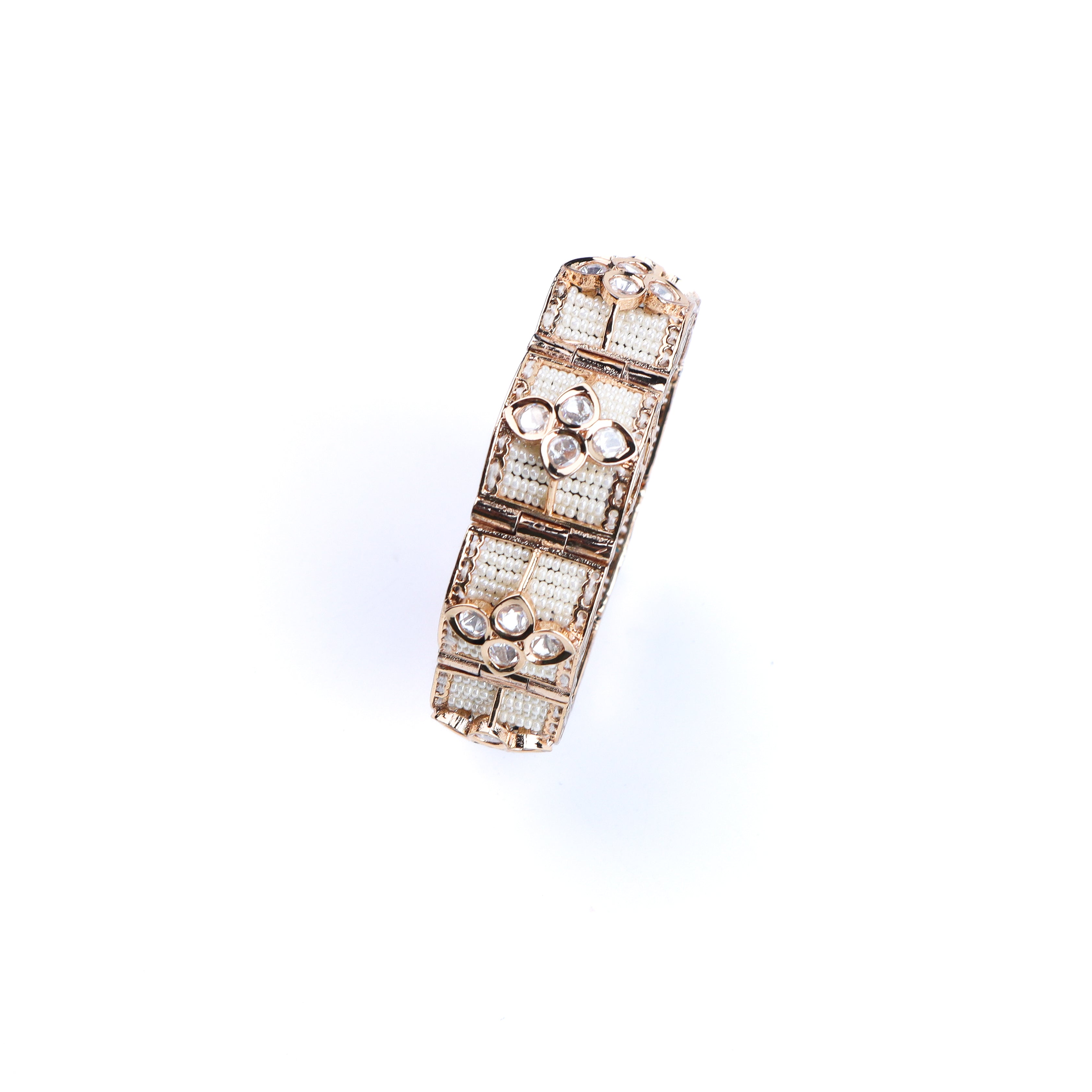 Angled view of a 22K gold-plated fashion bracelet highlighting its elegant structure, design, and polished gold finish