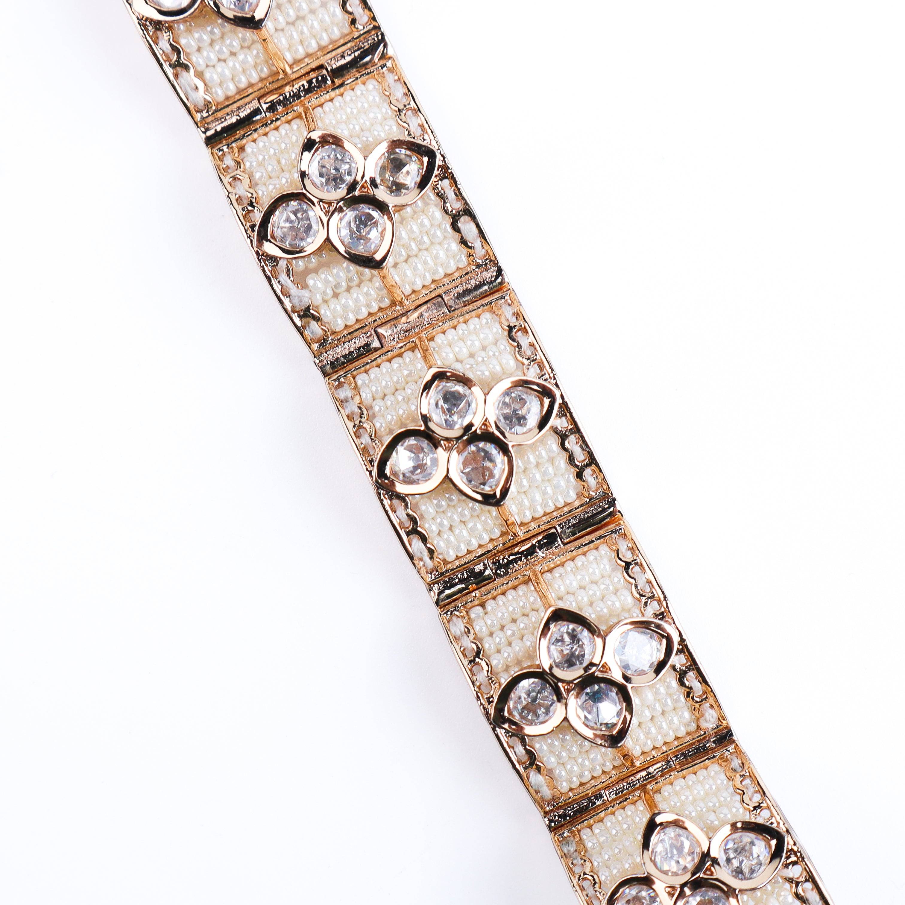 Detailed view of 22K gold-plated fashion bracelet highlighting intricate motifs, textured detailing, and a premium 22K gold-plated finish