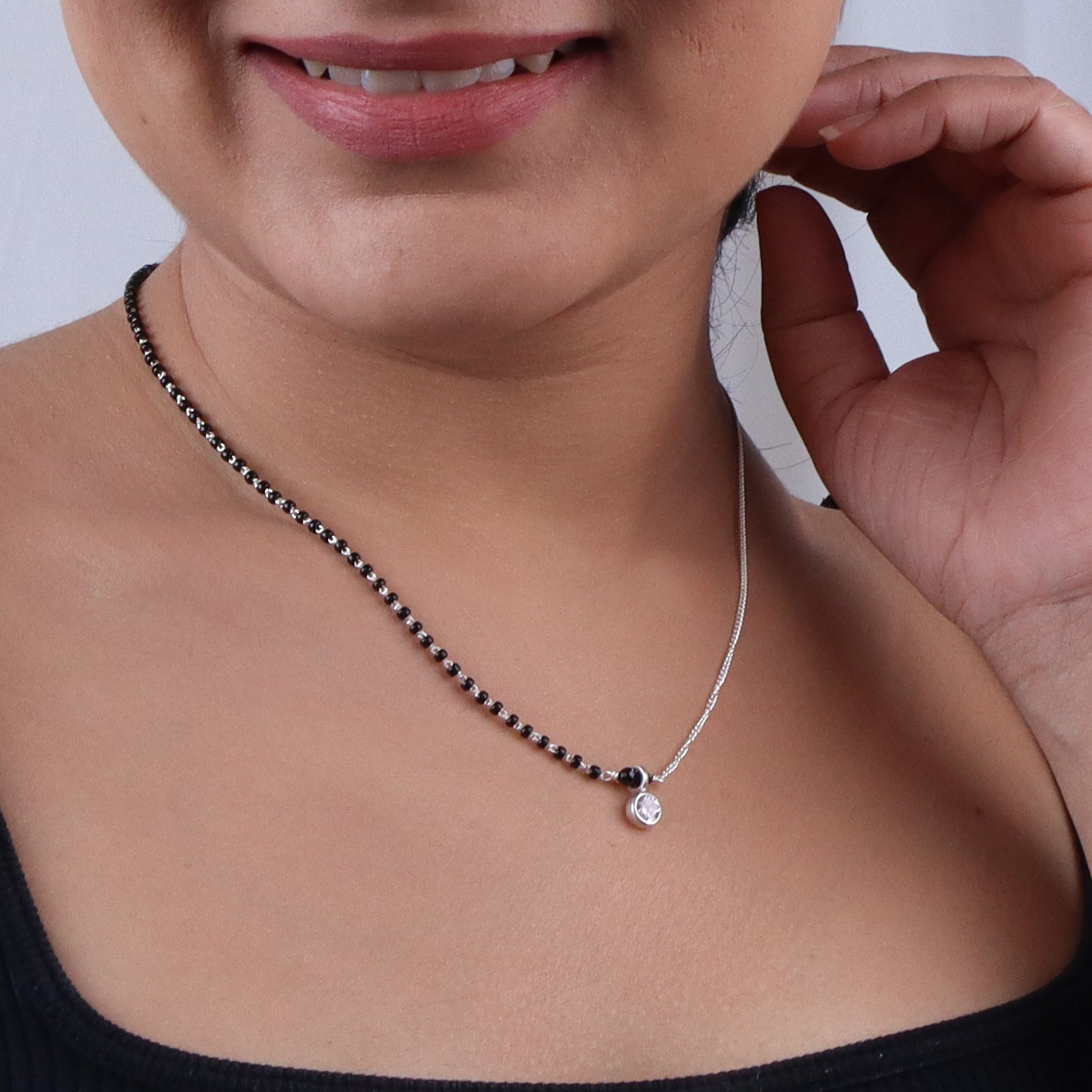 Silver and black beaded necklace with pendant