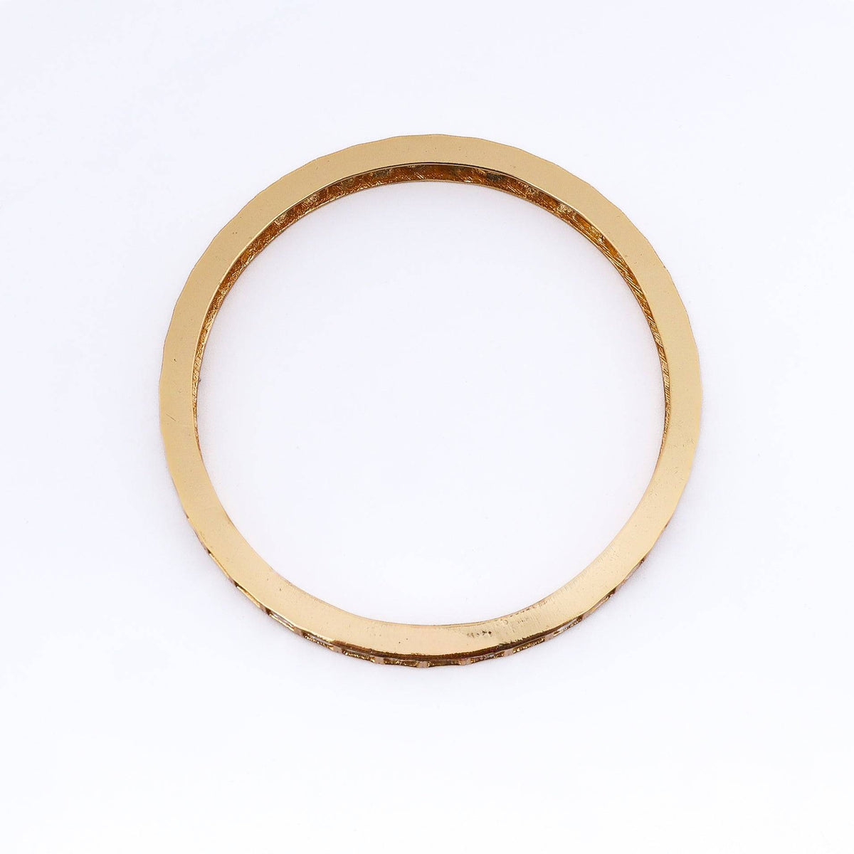 Detailed view of a 22K gold-plated fashion bangle (single) highlighting intricate motifs, textured detailing, and premium 22K gold plating