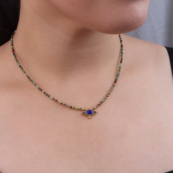 Model wearing a brass fashion necklace for a stylish and contemporary fashion jewellery look