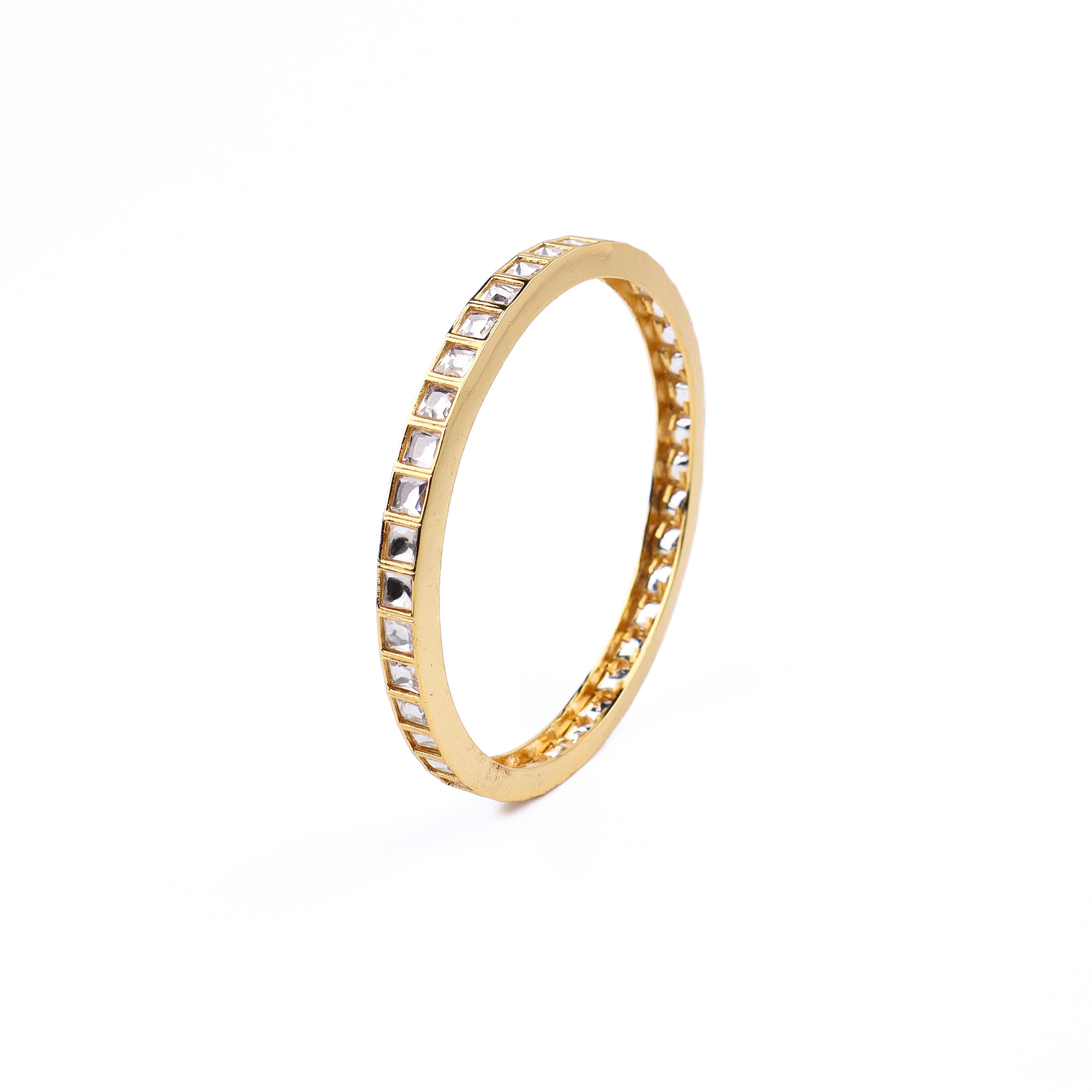 Angled view of 22K gold-plated fashion bangle (single) highlighting its elegant structure and polished gold finish