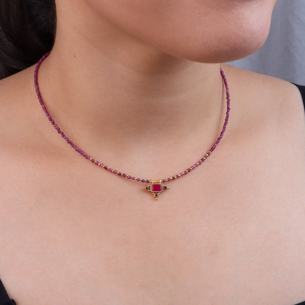 Model wearing a brass fashion necklace for a stylish and contemporary fashion jewellery look
