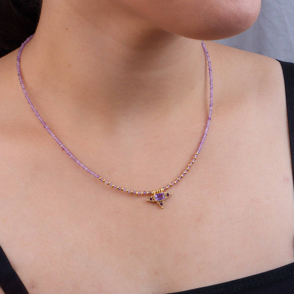 Model wearing a brass fashion necklace for a stylish and contemporary fashion jewellery look