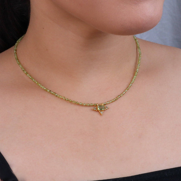 Model wearing a brass fashion necklace for a stylish and contemporary fashion jewellery look