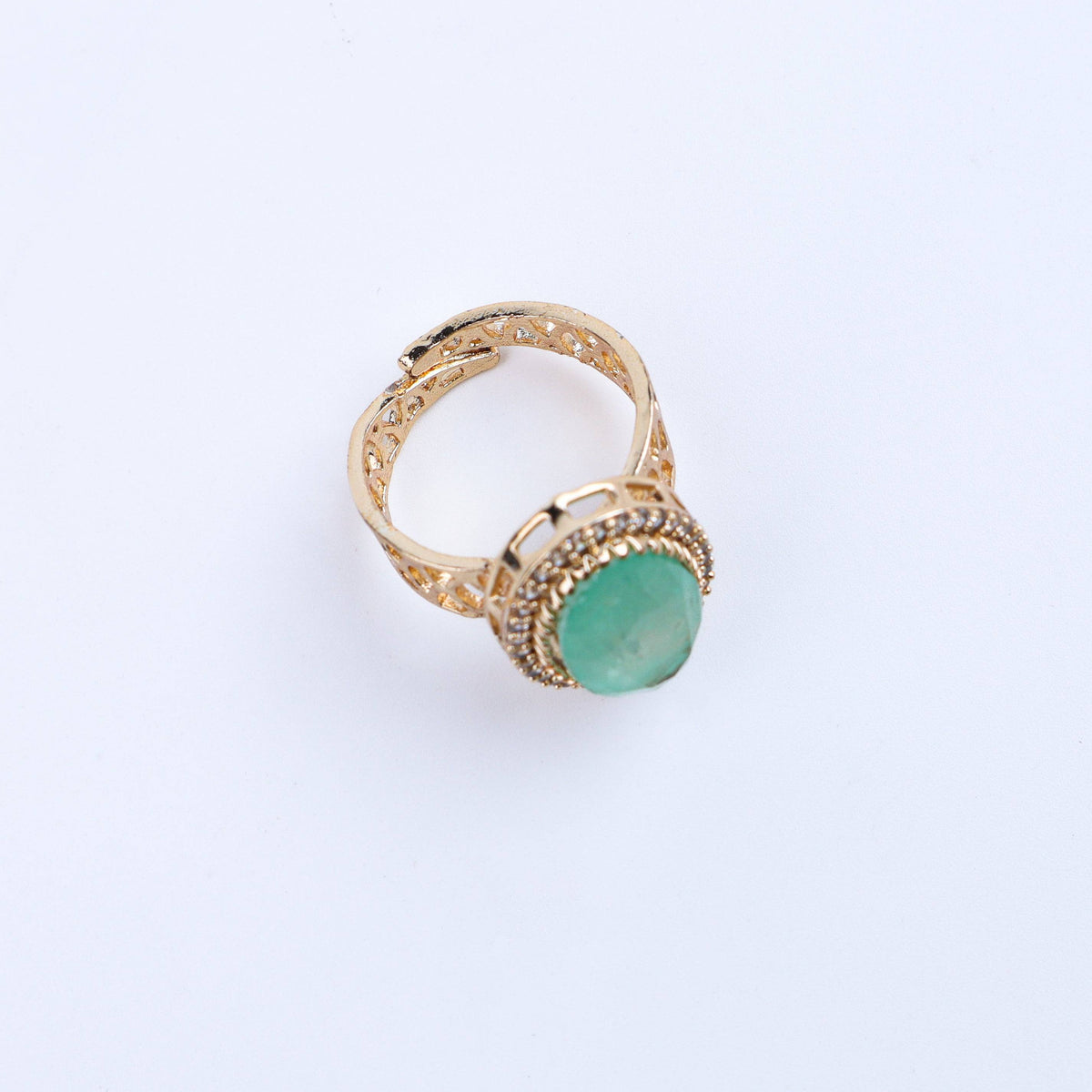 Angled view of a 22K gold-plated fashion ring highlighting its elegant shape, structure, and polished gold finish