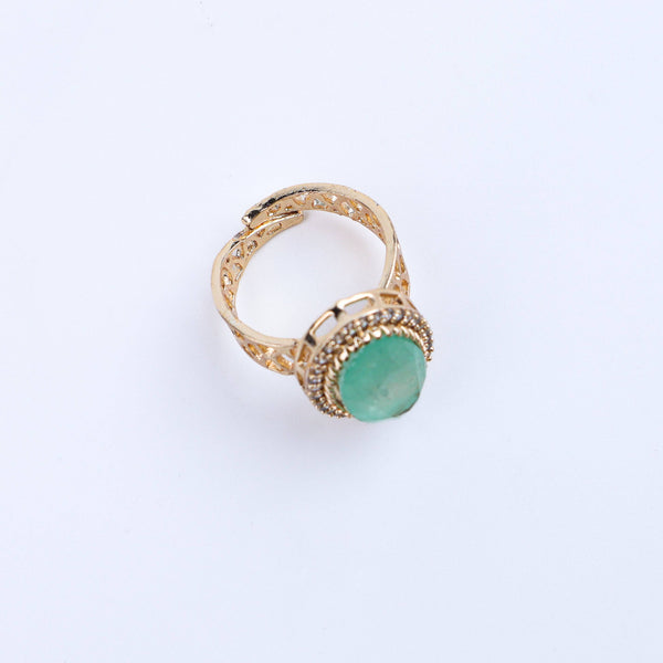 Angled view of a 22K gold-plated fashion ring highlighting its elegant shape, structure, and polished gold finish