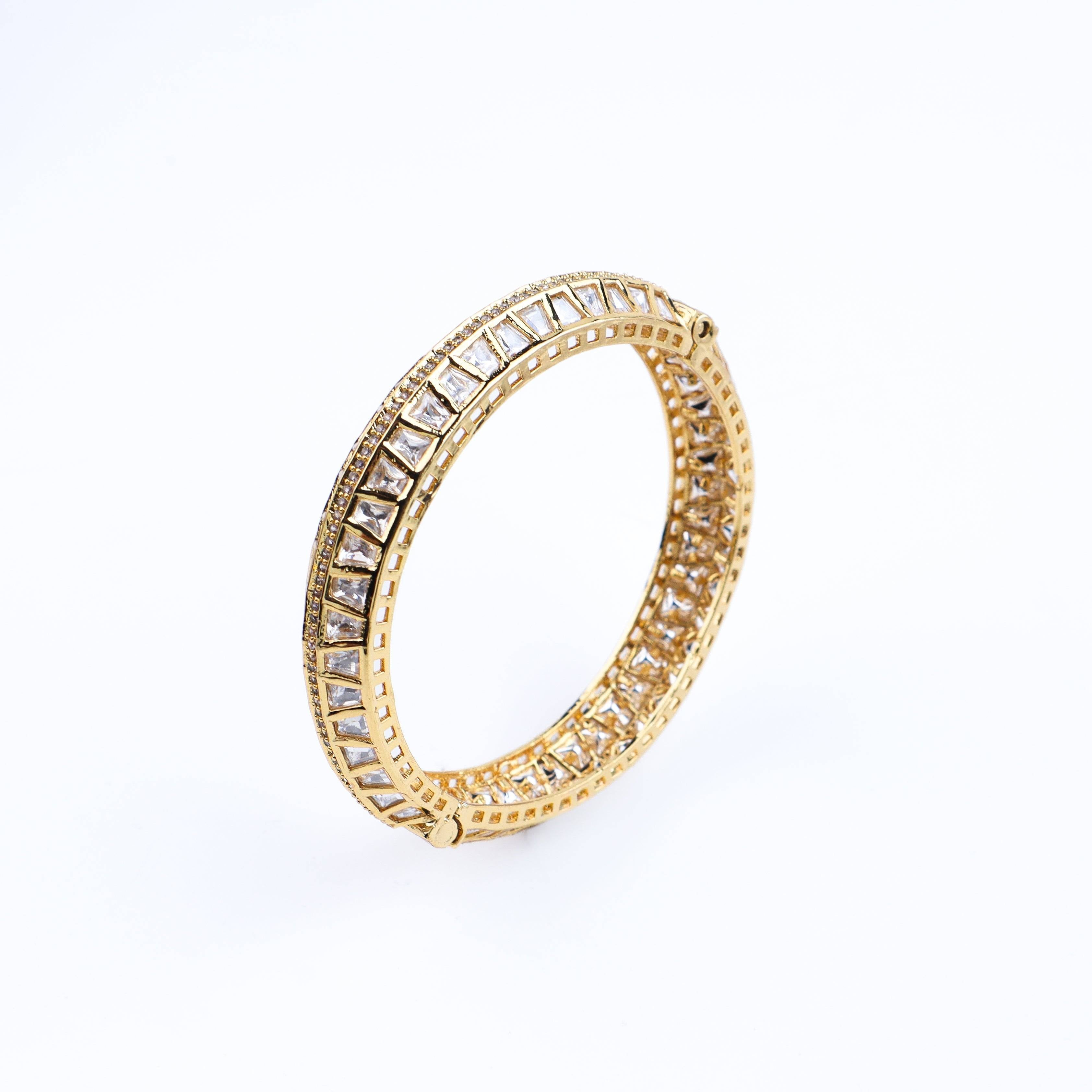 Angled view of 22K gold-plated fashion bangle (single) highlighting its elegant structure and polished gold finish