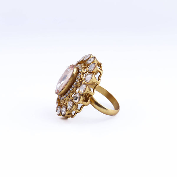 Angled view of a 22K gold-plated fashion ring highlighting its elegant shape, unique structure, and polished gold finish