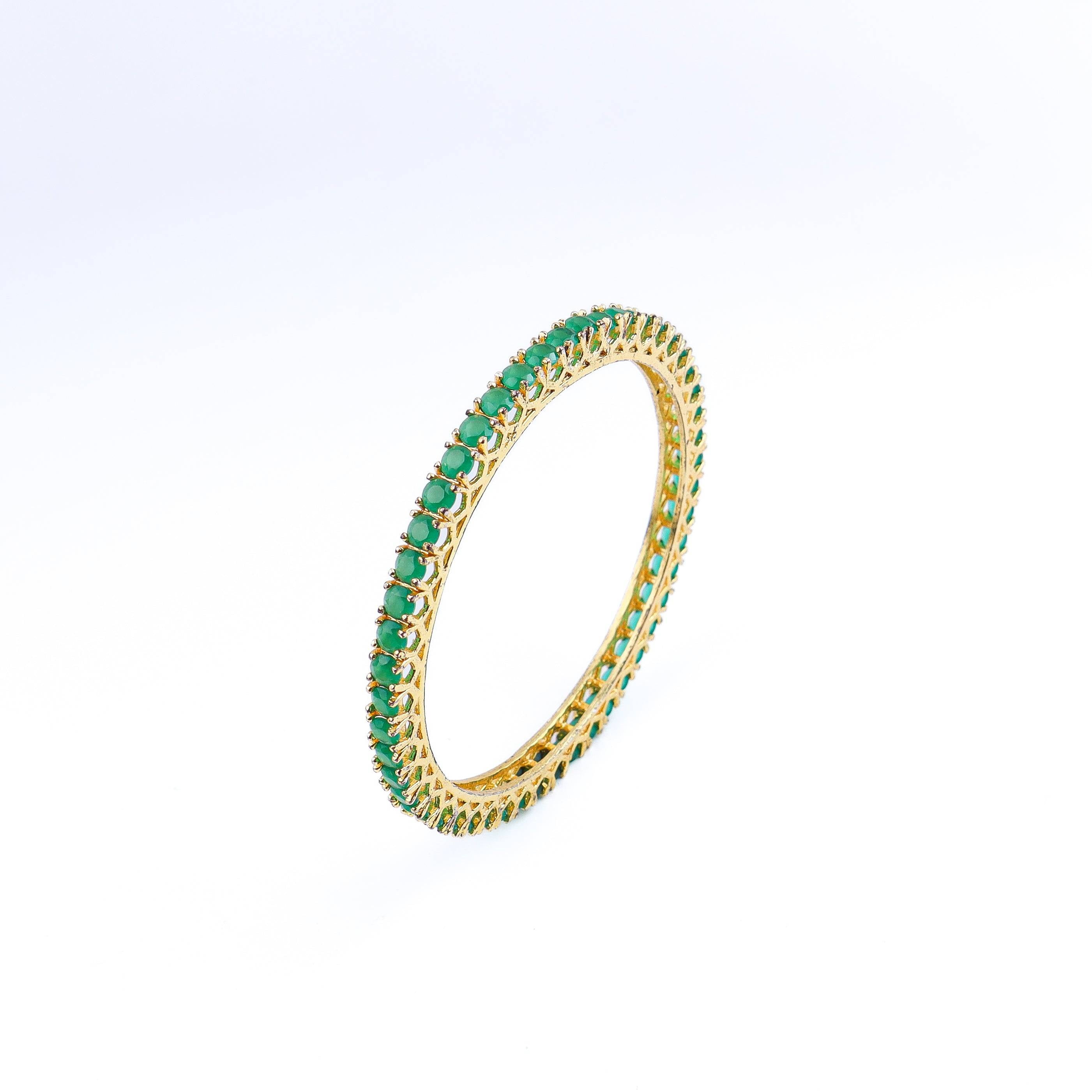 Angled view of a 22K gold-plated fashion bangle (single) highlighting its elegant structure and polished gold finish