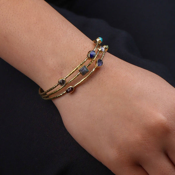 Model wearing a brass fashion bracelet for a stylish and contemporary fashion jewelry look