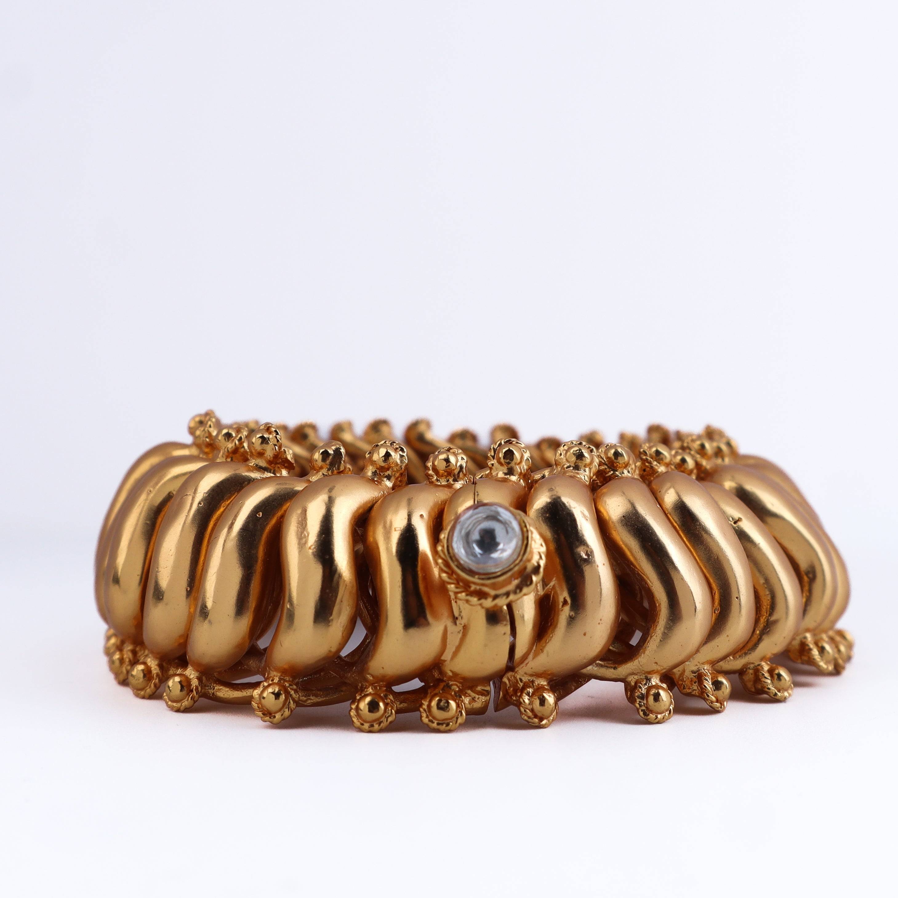 Close-up of a 22K gold-plated fashion bangle (single) showcasing intricate detailing, fine craftsmanship, and rich 22K gold plating