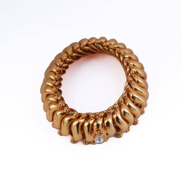Angled view of 22K gold-plated fashion bangle (single) highlighting its elegant structure and polished gold finish
