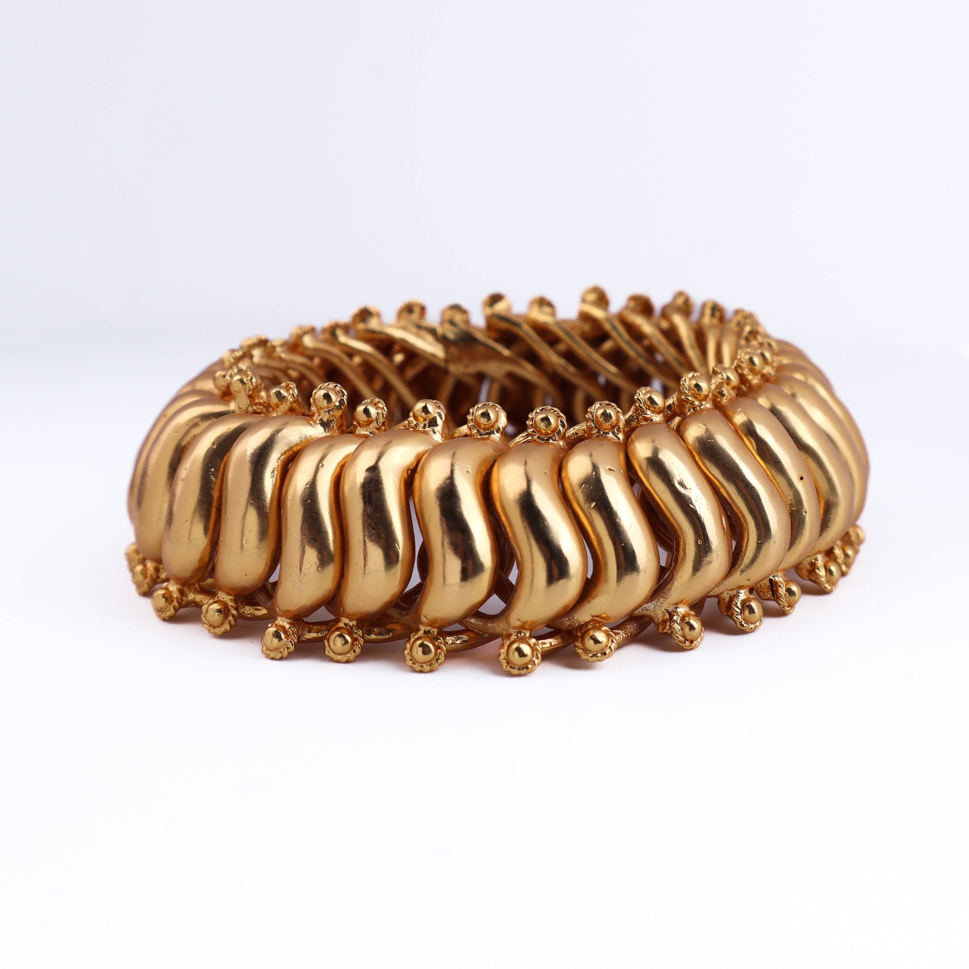 Detailed view of a 22K gold-plated fashion bangle (single) highlighting intricate motifs, textured detailing, and premium 22K gold-plated finish