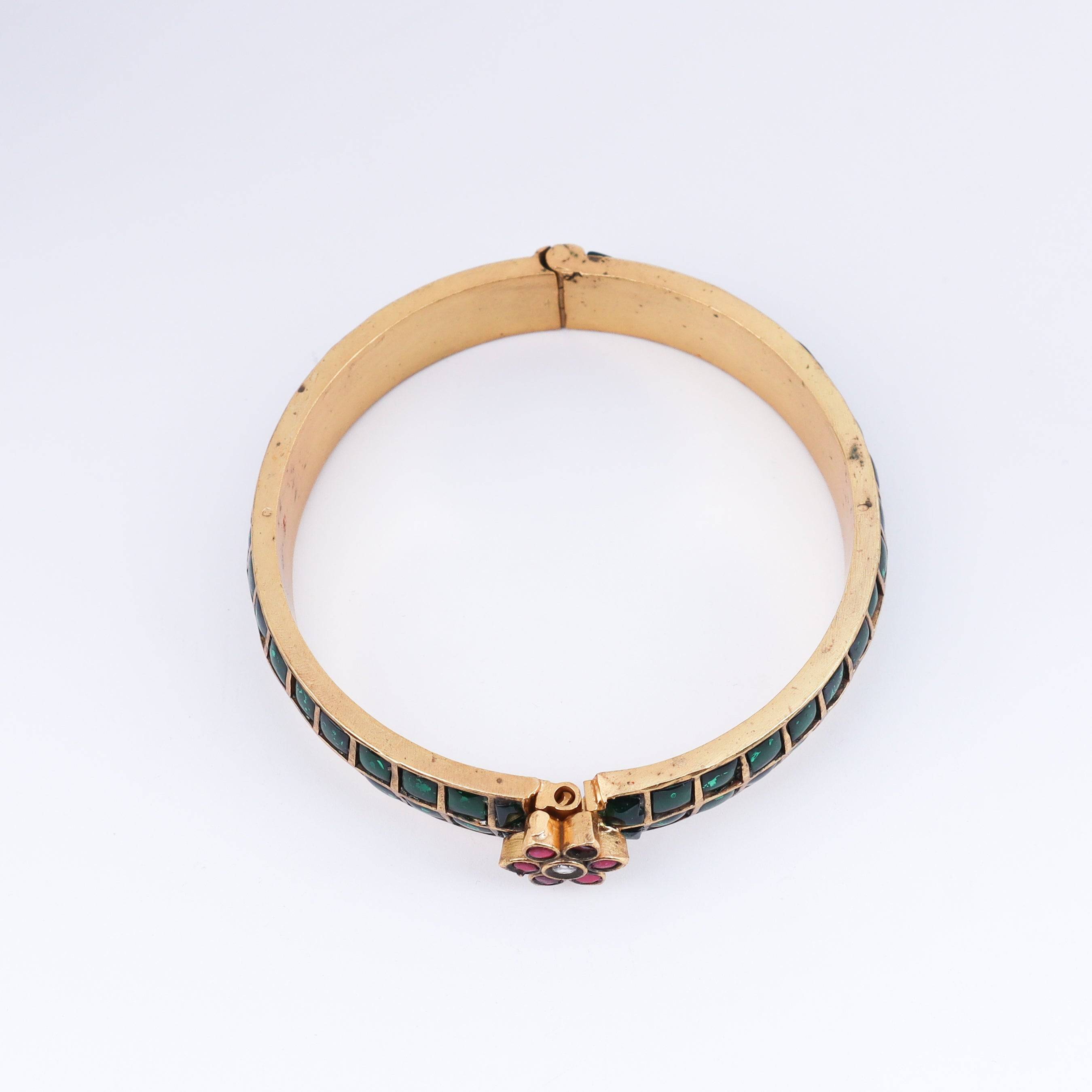 Detailed view of a 22K gold-plated fashion bangle (single) highlighting intricate motifs, textured detailing, and premium 22K gold plating