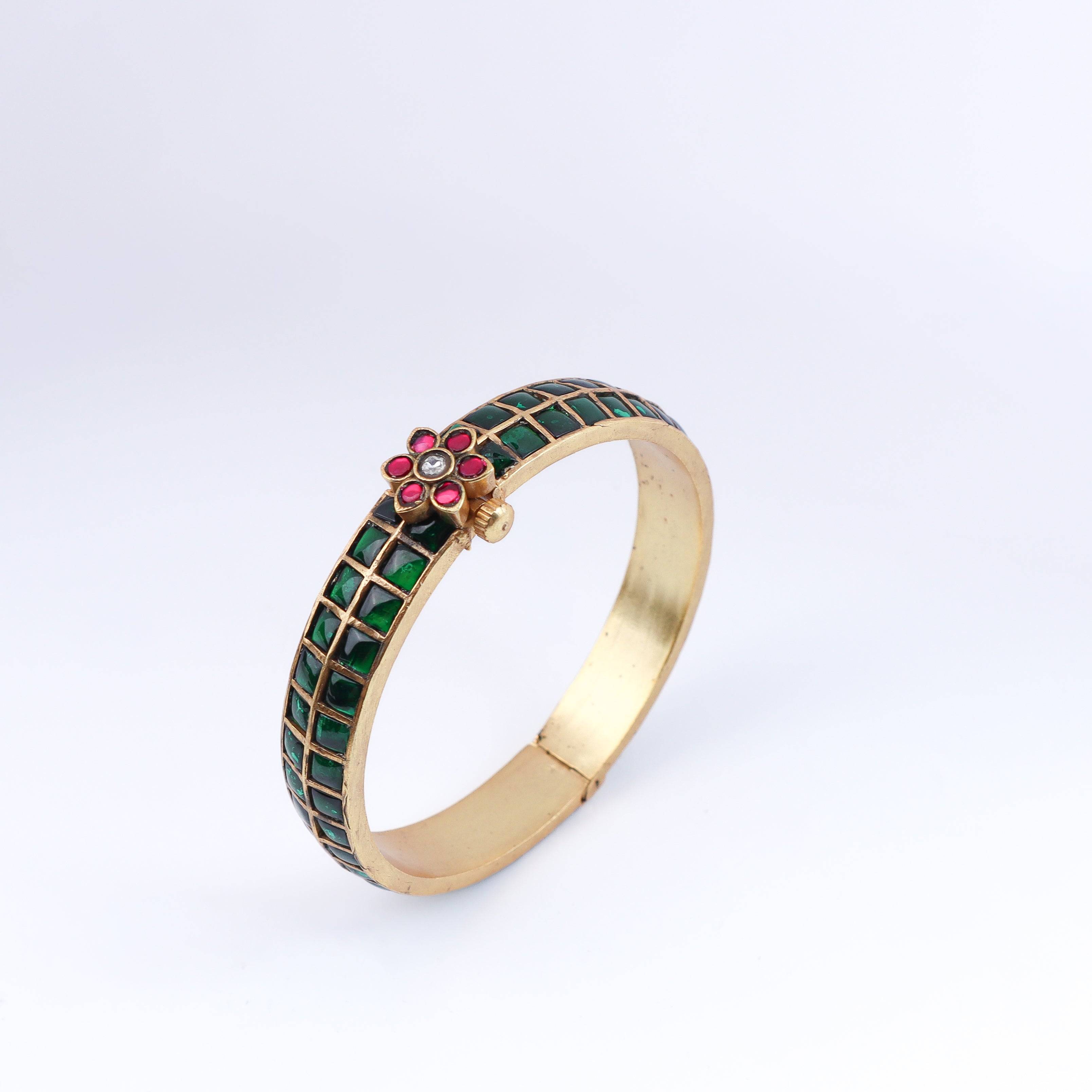 Angled view of a 22K gold-plated fashion bangle (single) highlighting its elegant structure and polished gold finish