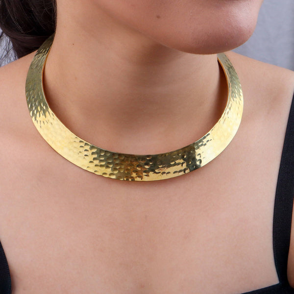 Model wearing a brass fashion necklace for a stylish and contemporary fashion jewellery look