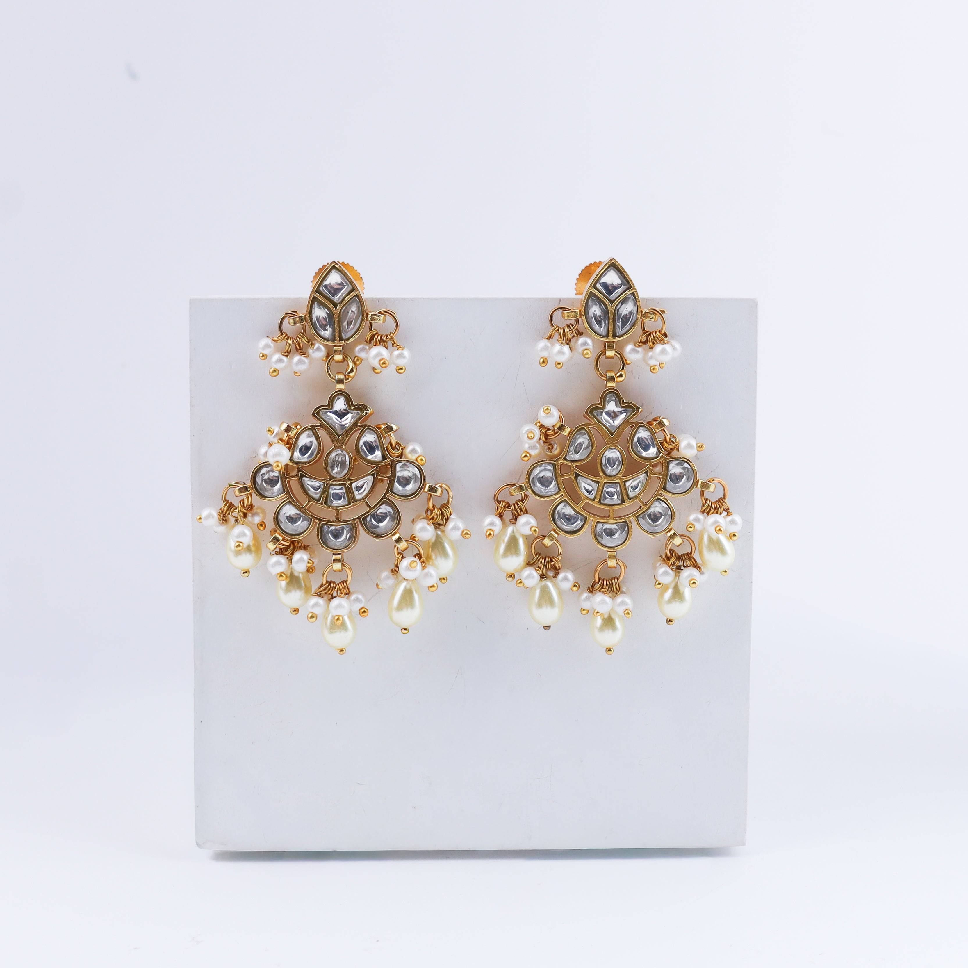 Detailed view of a 22K gold-plated fashion earring highlighting intricate motifs, textured detailing, and a premium 22K gold-plated finish