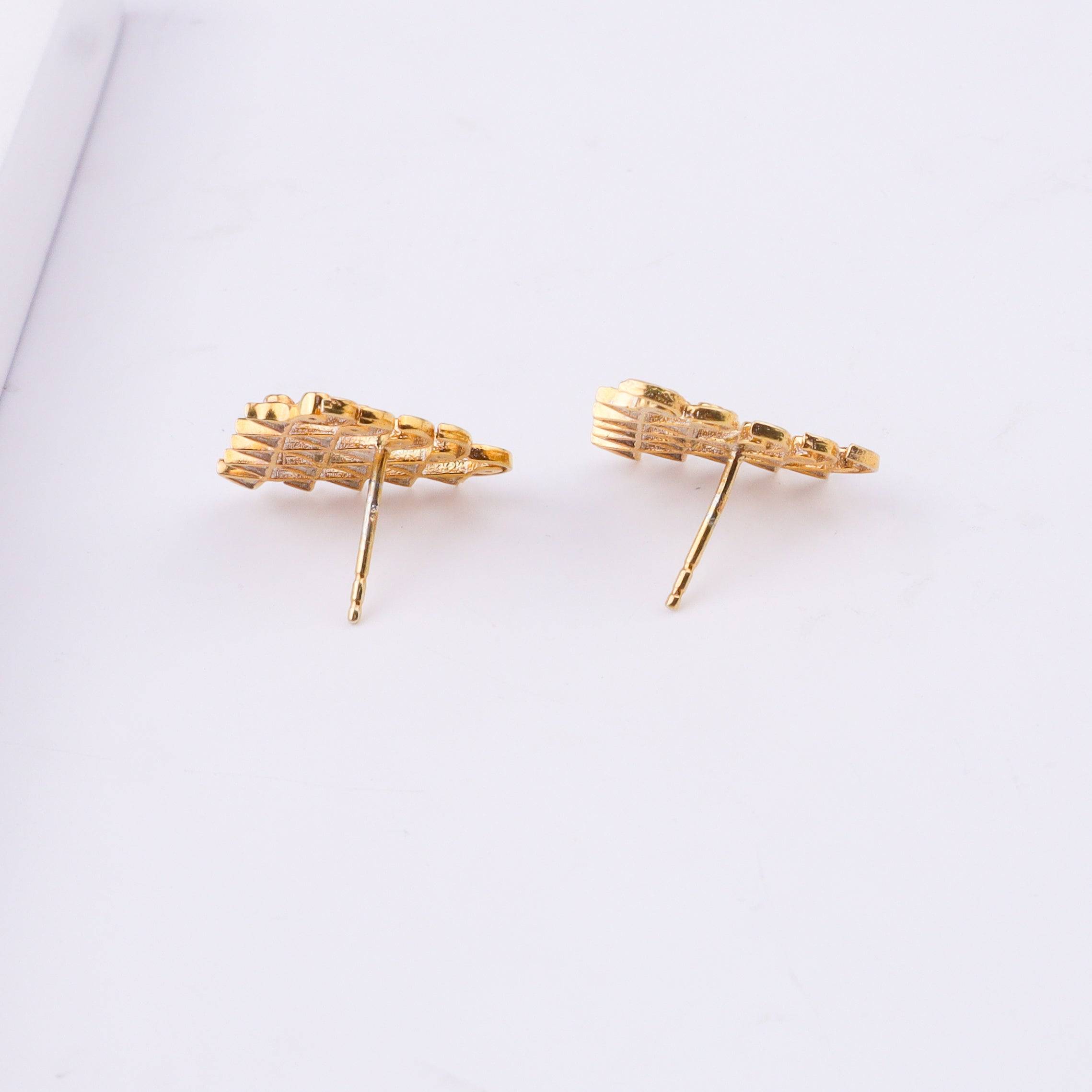 Angled view of Saraswati Earrings featuring a traditional design with premium 22K gold plating