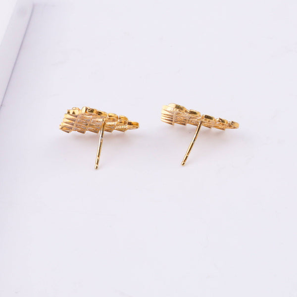 Angled view of Saraswati Earrings featuring a traditional design with premium 22K gold plating