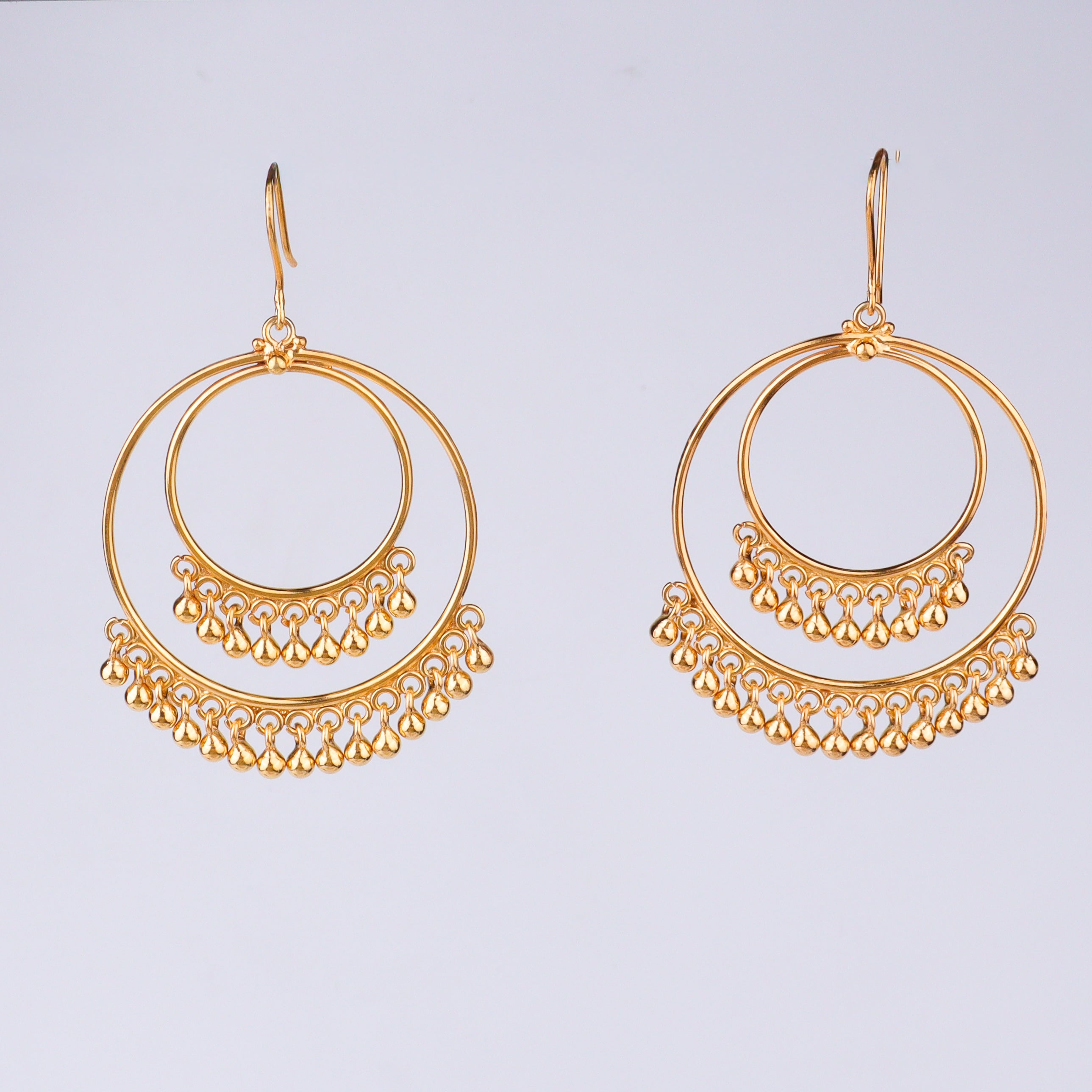 Gold earrings with dangling beads