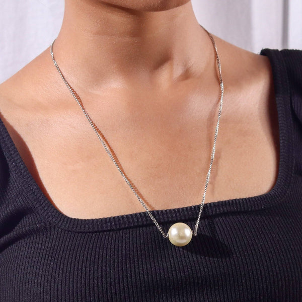 Model wearing a pearl chain fashion necklace for a chic and sophisticated fashion jewelry look