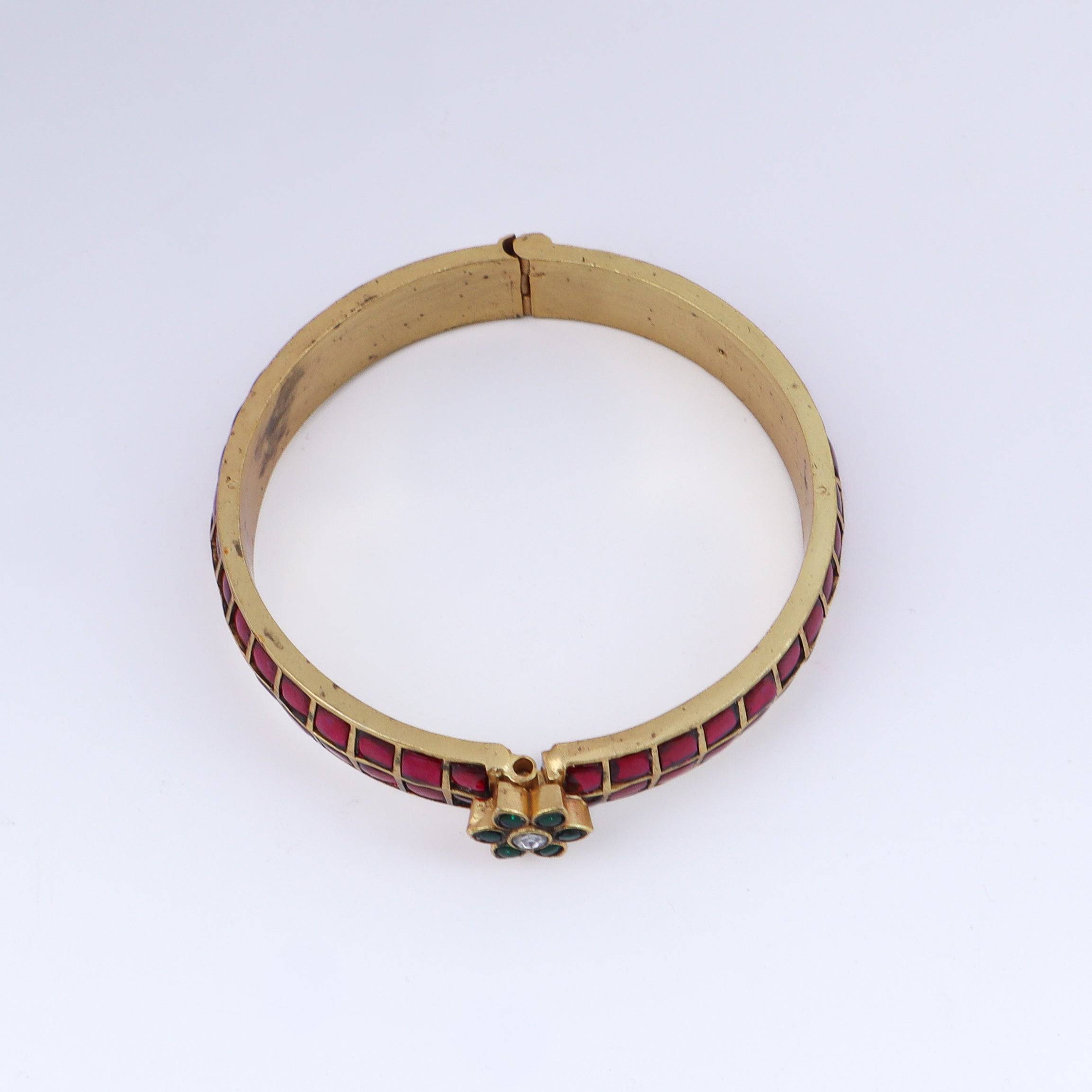 Detailed view of a 22K gold-plated fashion bangle (single) highlighting intricate motifs, textured detailing, and premium 22K gold plating