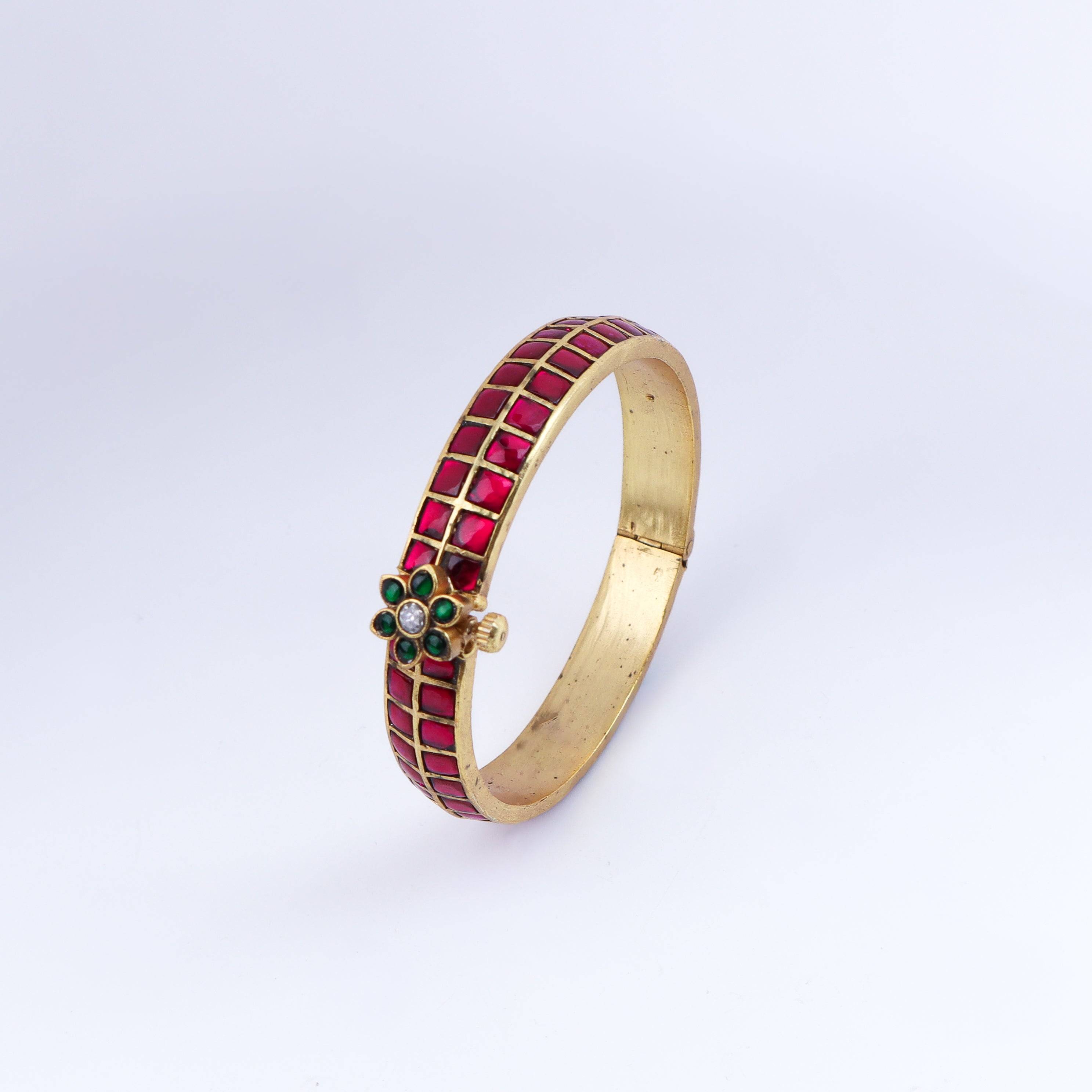 Angled view of a 22K gold-plated fashion bangle (single) highlighting its elegant structure and polished gold finish