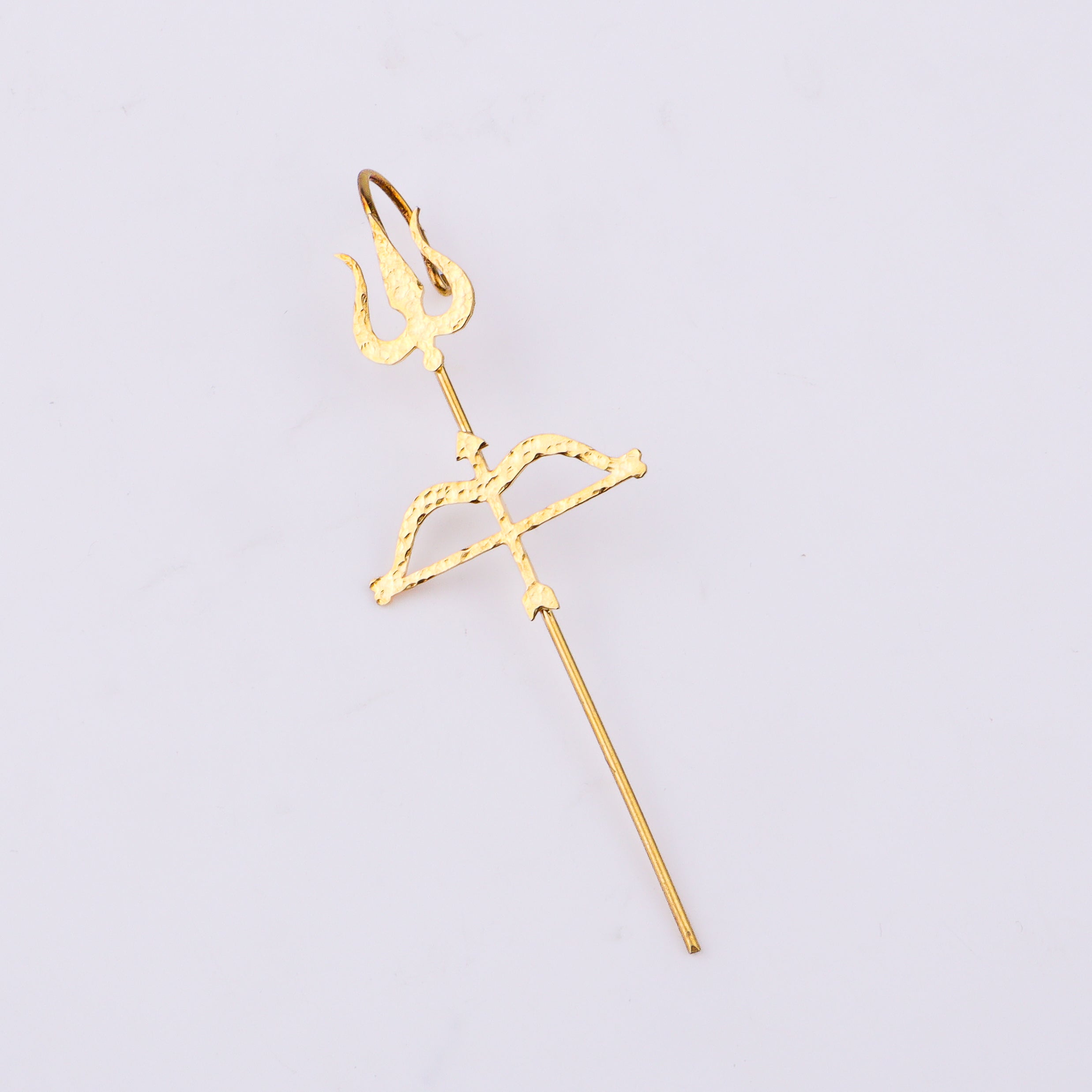 Close-up of gold Trishul Earcuff on ear