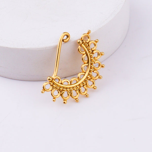 Gold filigree nose ring with certification label