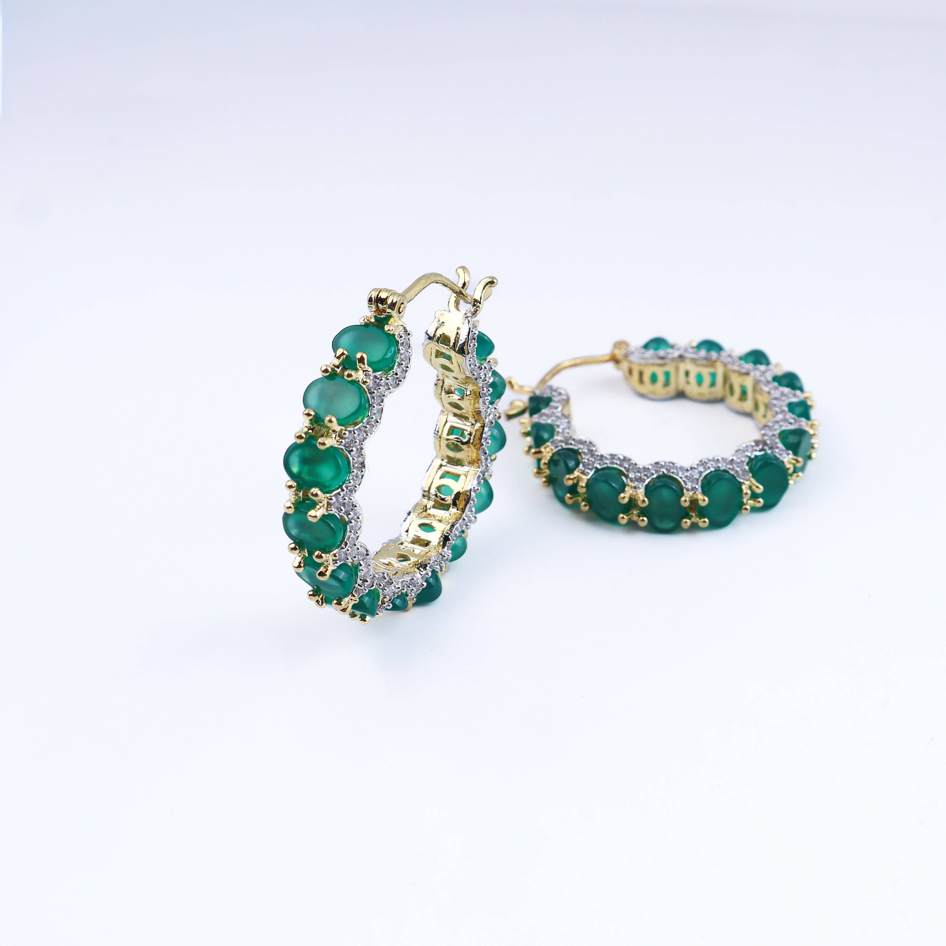 Angled view of a 22K gold-plated fashion earring highlighting its elegant silhouette, structure, and polished gold finish
