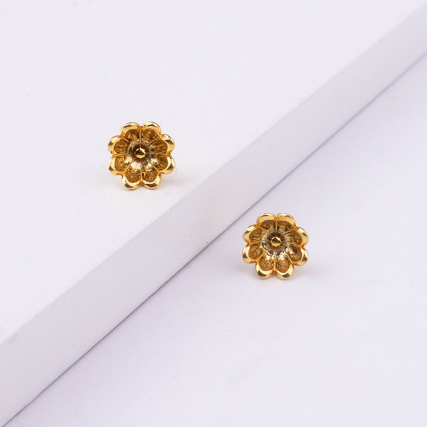 Gold flower earrings with white background