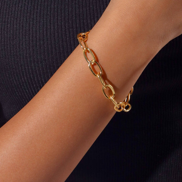 Model wearing 22K gold-plated fashion bracelet for a sophisticated and contemporary jewelry look