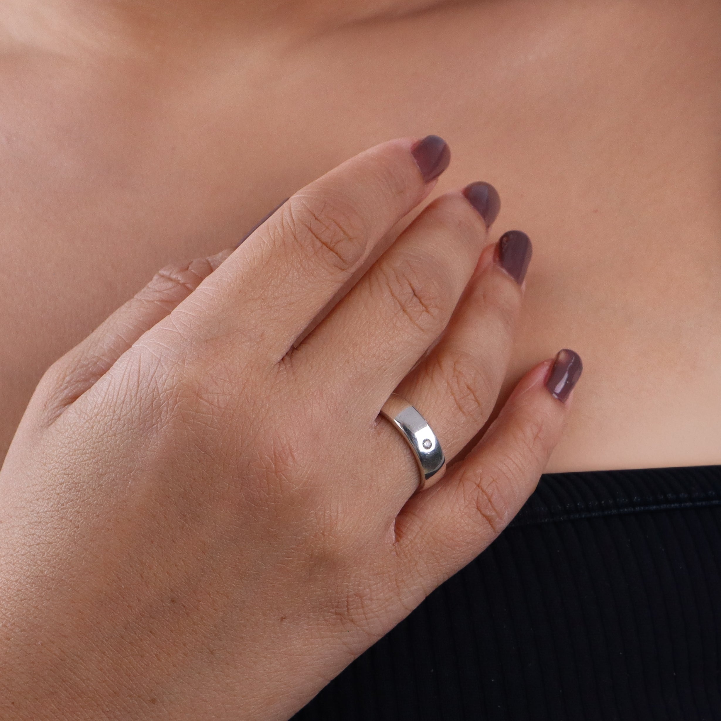 Silver CZ unisex band ring on finger