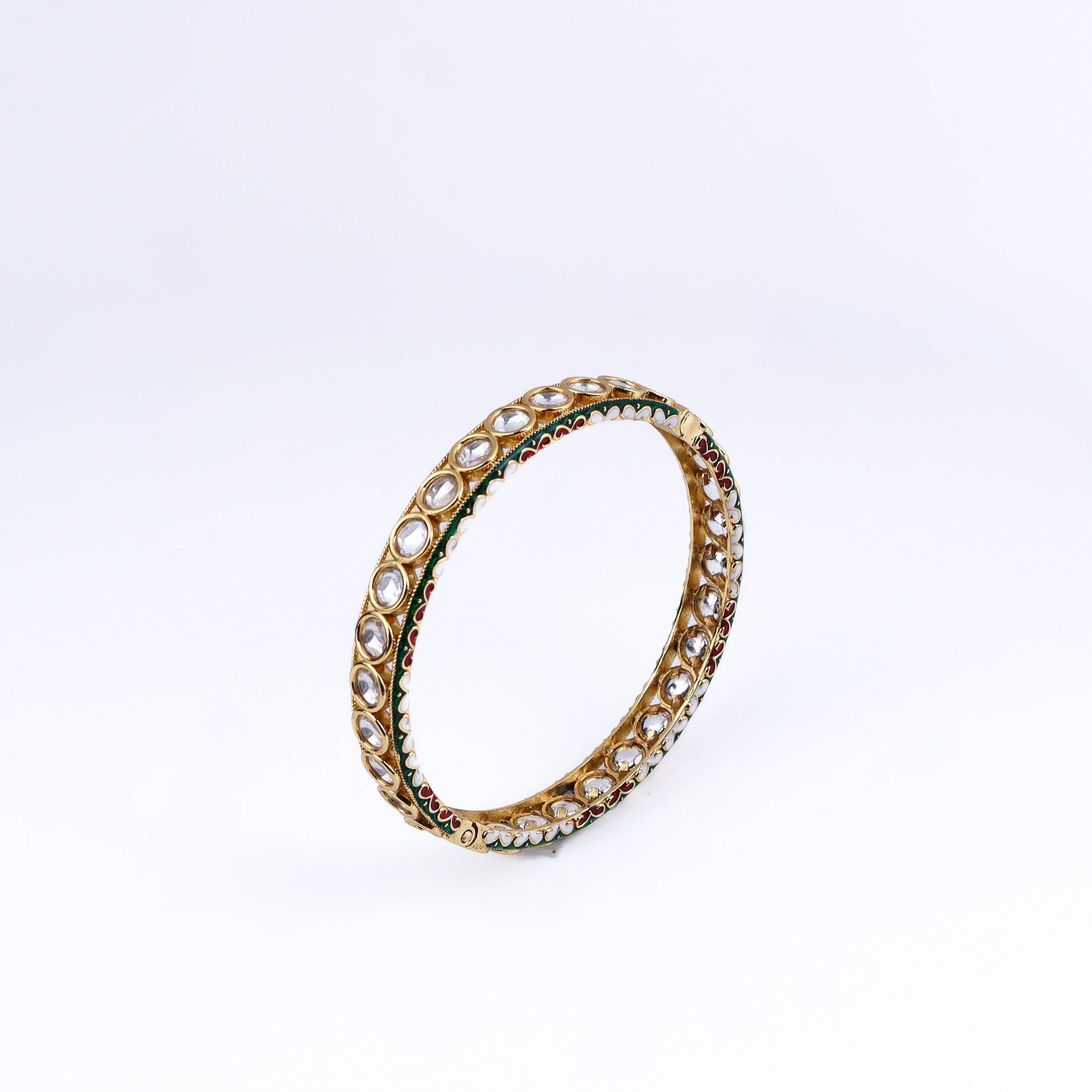 Angled view of a 22K gold-plated fashion bangle (single) highlighting its elegant structure and polished gold finish