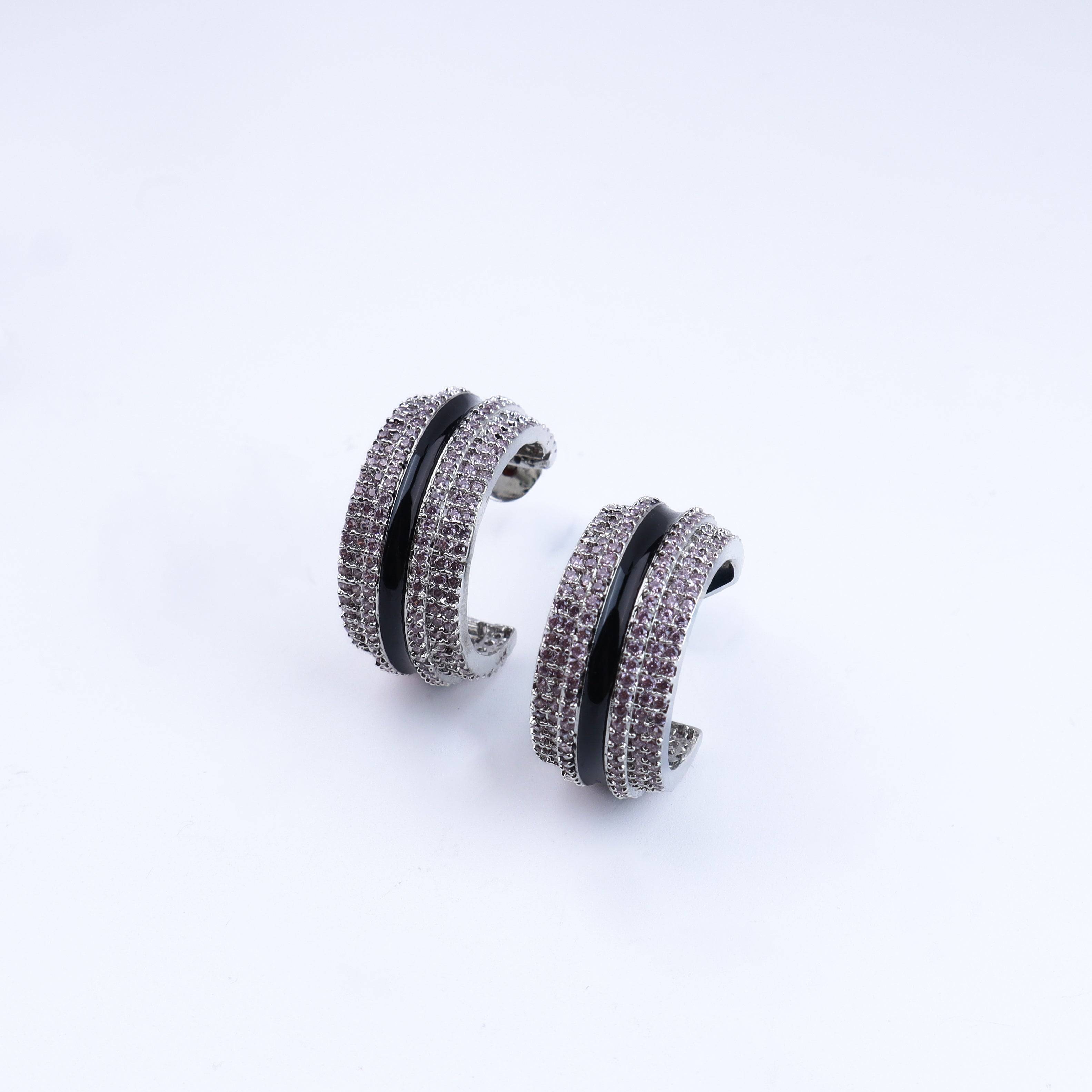 Detailed view of the fashion earring highlighting intricate motifs, textured detailing, and a smooth jewelry finish