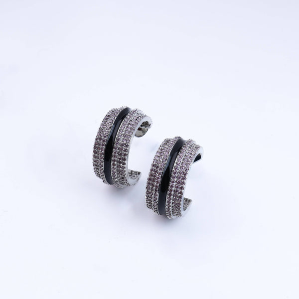 Detailed view of the fashion earring highlighting intricate motifs, textured detailing, and a smooth jewelry finish