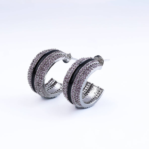 Close-up of a fashion earring showcasing intricate detailing, fine craftsmanship, and a refined finish