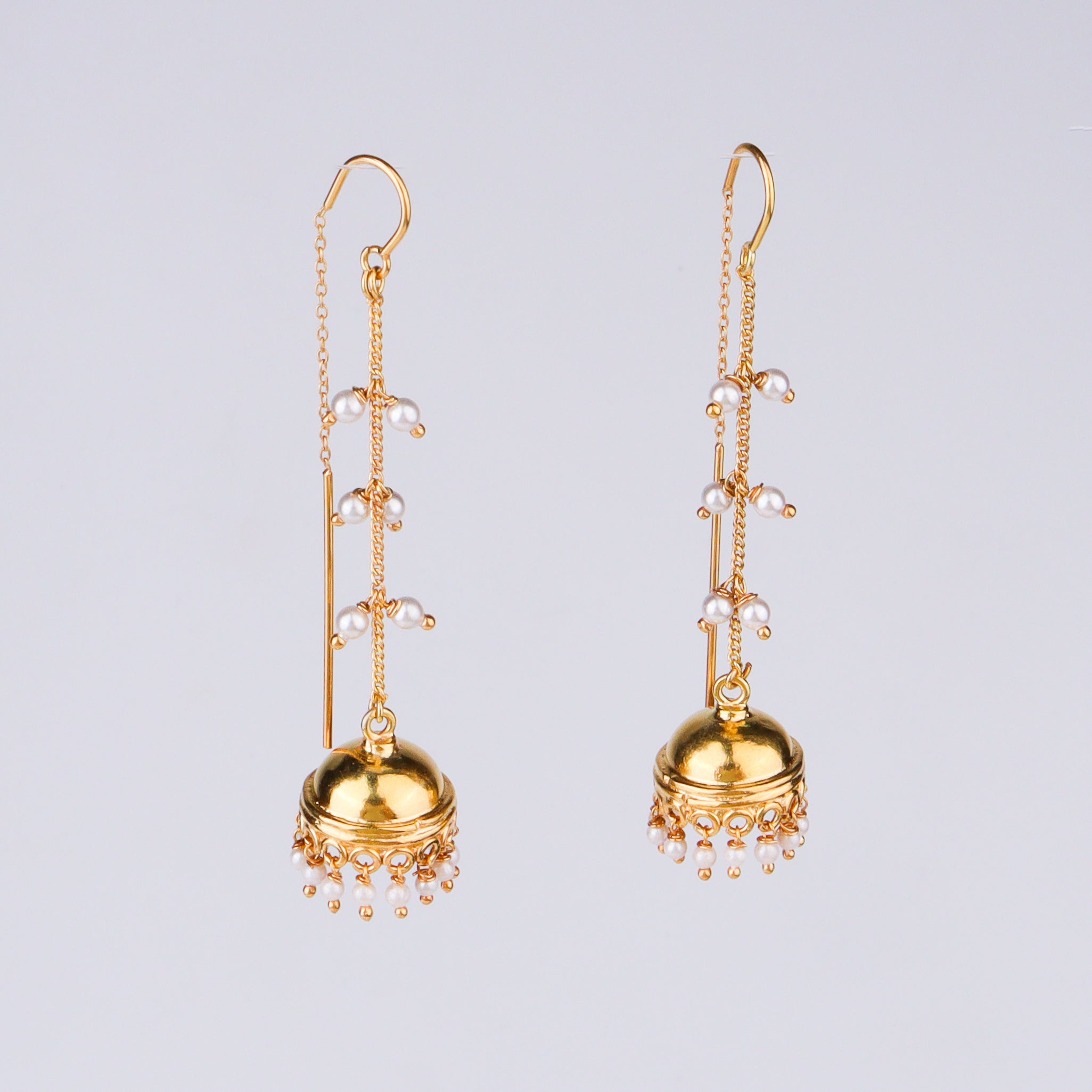 Gold jewelry earrings with pearl embellishments