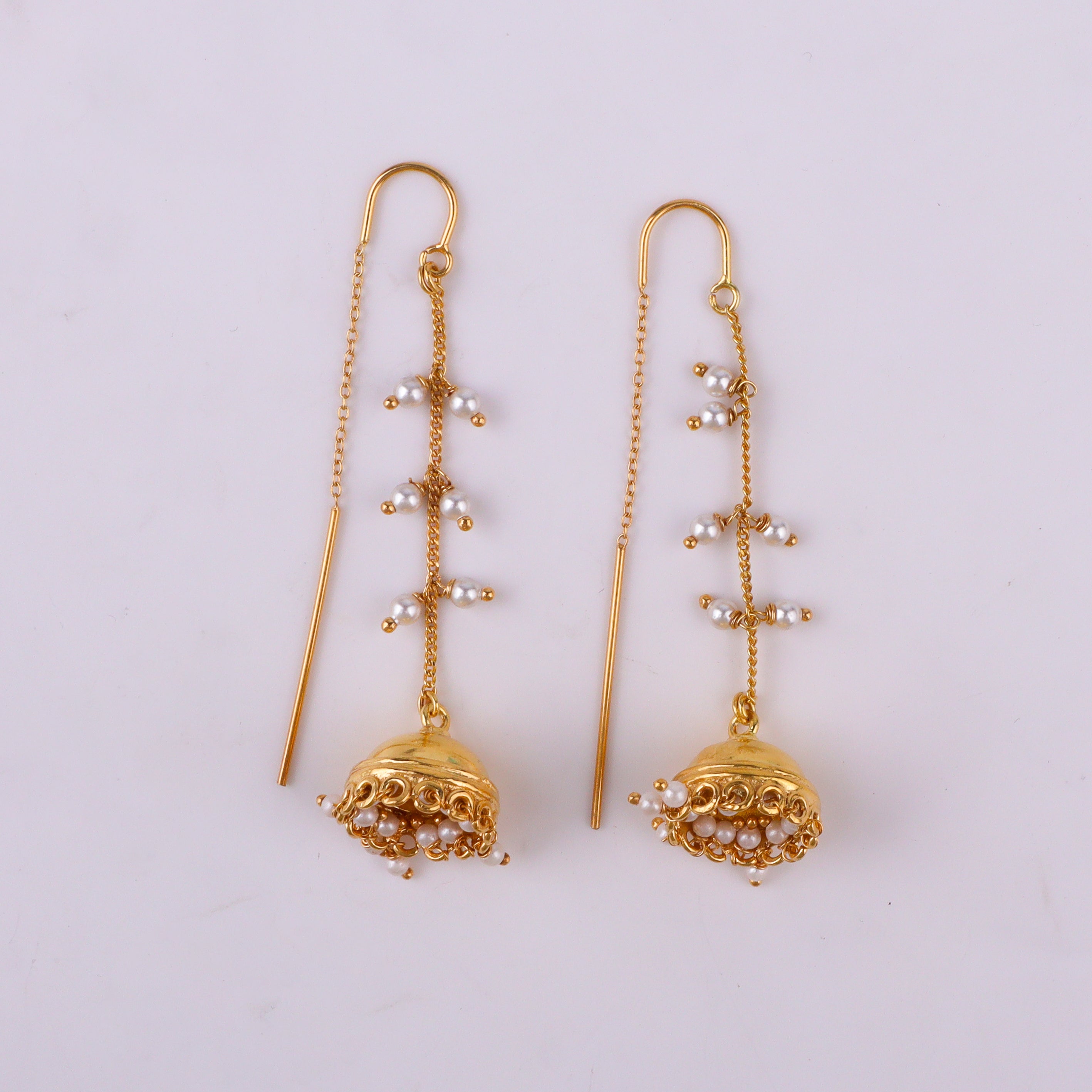 Gold earrings with dangling pearl beads