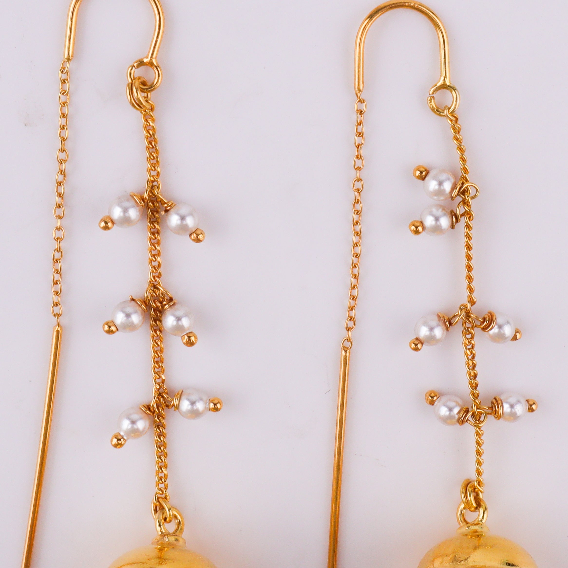 Elegant gold chain earrings with pearl drops