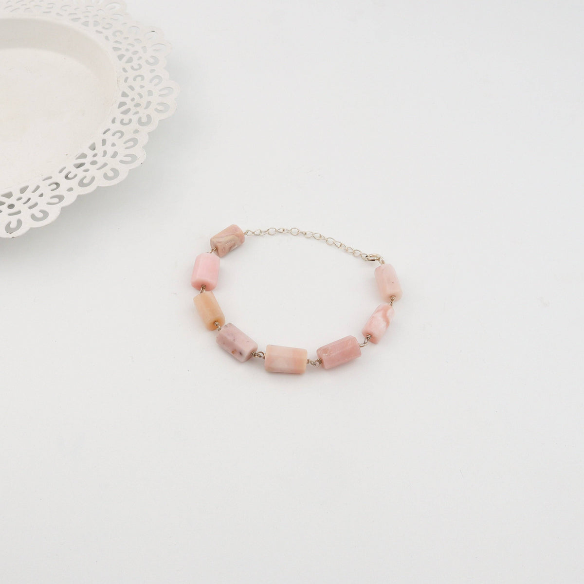 Detail shot of ganthan pattern and pink opal stone setting