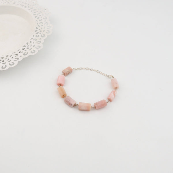 Detail shot of ganthan pattern and pink opal stone setting